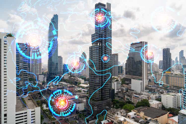 World planet Earth map hologram over panorama city view of Bangkok, Asia. The concept of international connections and business. Multi Exposure