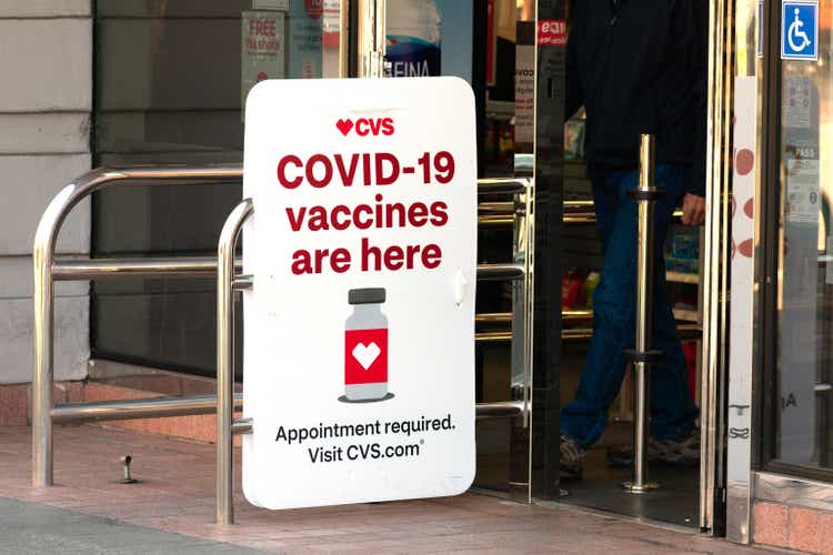 Covid-19 vaccines are here sign advertises coronavirus vaccination location at CVS Pharmacy store - Palo Alto, California, USA - February, 2021