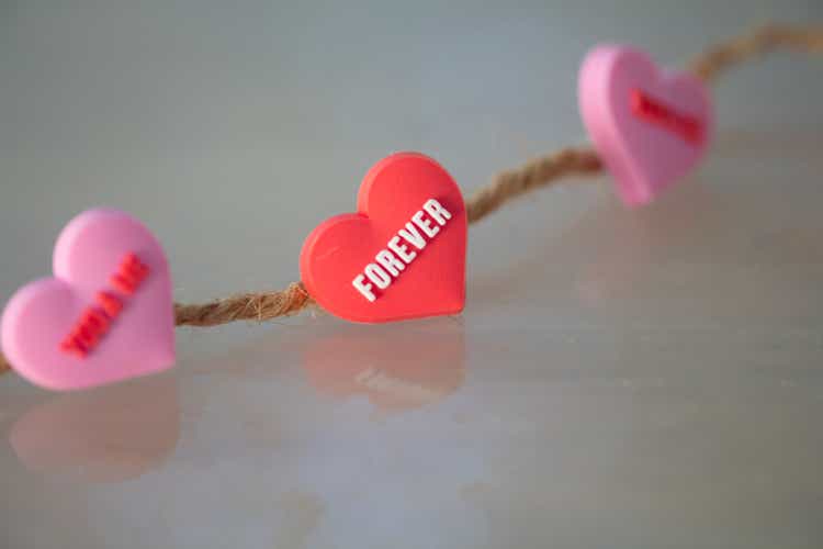 Red and pink hearts on a rope.  Concept of recognition of love, romantic relationships, Valentine
