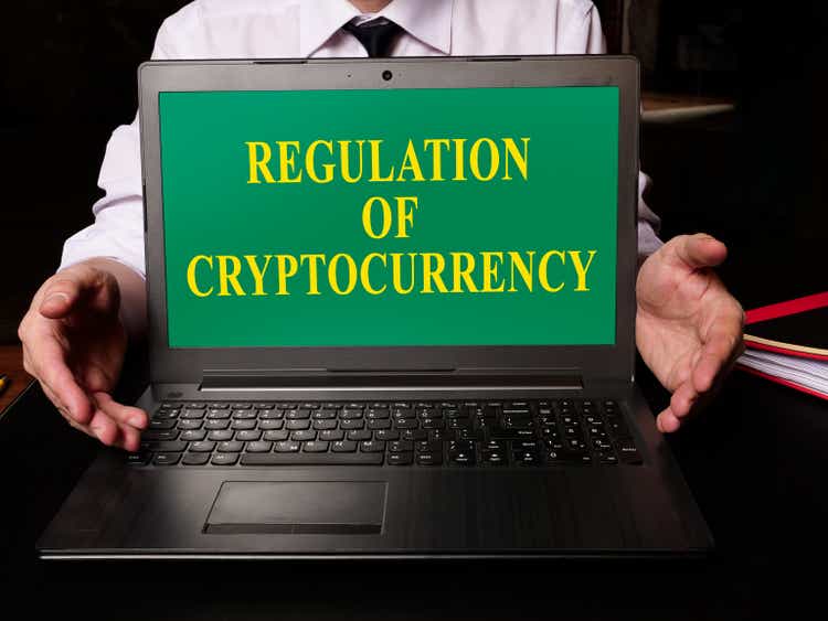 Regulation of Cryptocurrency law on the laptop.