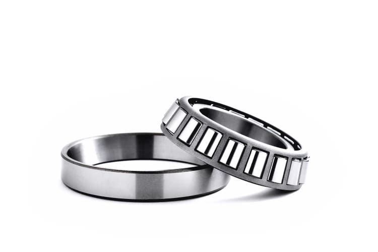roller bearing on a white background close-up, blur as an artistic device, place for copy space