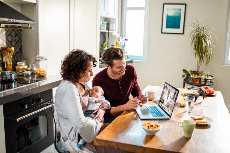 Young family talking to their pediatrician over a video call