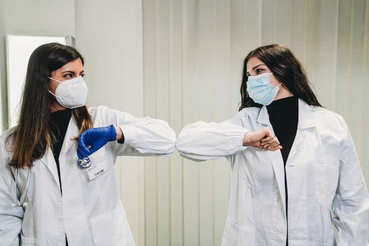 Portrait of two young female doctors in their office at the hospital