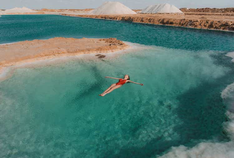 Woman swimming in salt lake in Siwa oasis