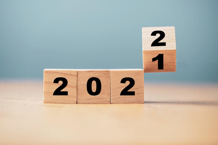 Flipping of wooden cube block for change 2021 to 2022 year , Preparation for merry Christmas and happy new year concept.