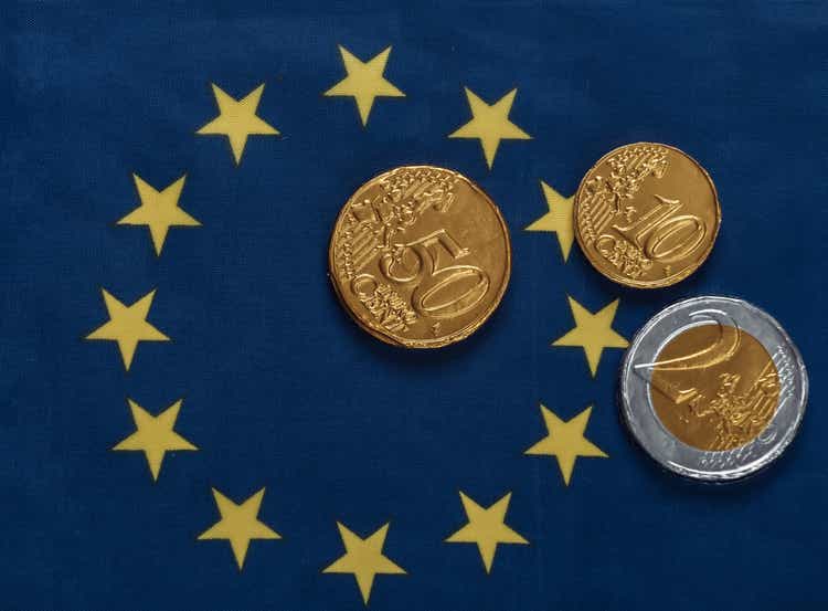 Euro Coins on Euro Union Flag Background