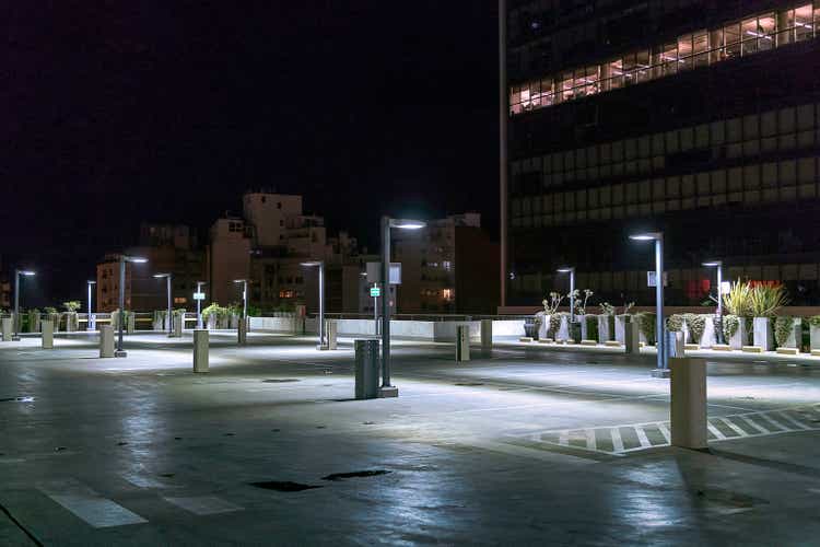 Empty parking lot at night.