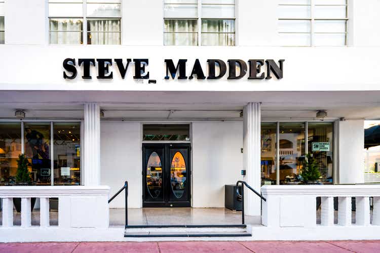 Art Deco district of South Beach in Florida with shoes clothing store sign for Steve Madden on Lincoln road street in summer