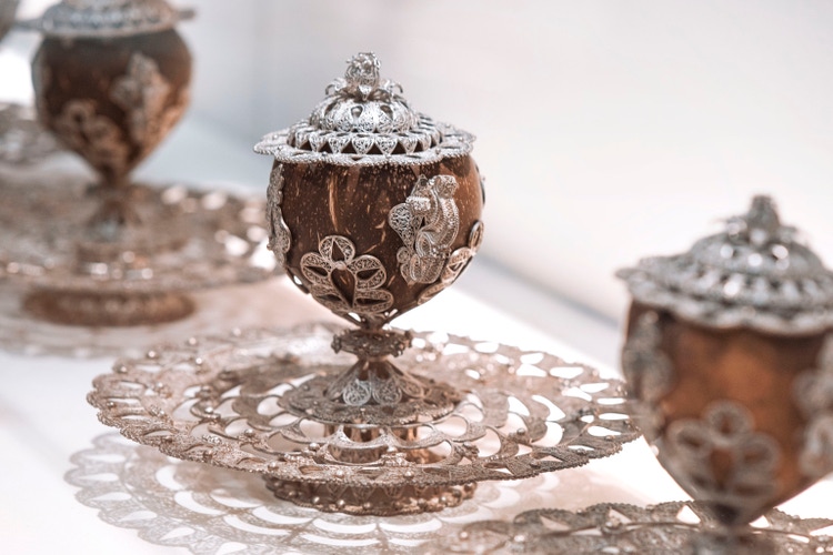 Vintage old dishes from cupronickel, of different sizes. Antique spoonsDishes of the aristocrats of the past. Antique dishes for food .