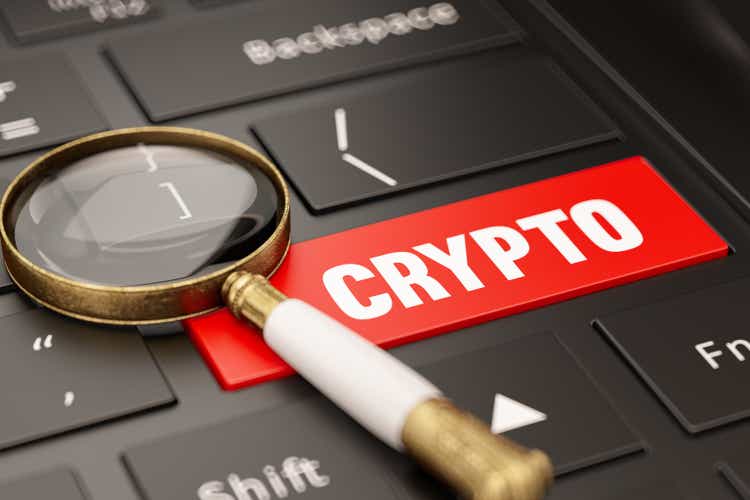 Crypto Currency Research Concept with Keyboard and Magnifier