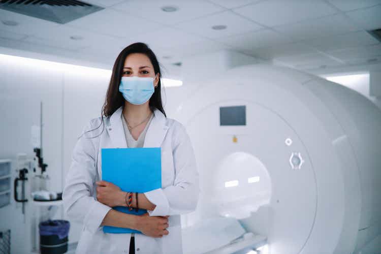 Portrait of a female doctor in the CT scanner room