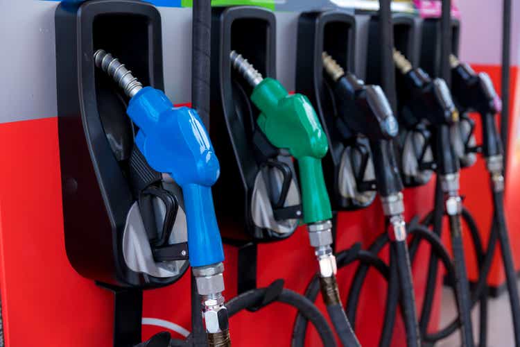 Fuel Pump, Gas Station, Gasoline.  Colorful gas pump nozzle isolated on white background, Service gas station in warm sunset.  Car refueling headquarters in Asia