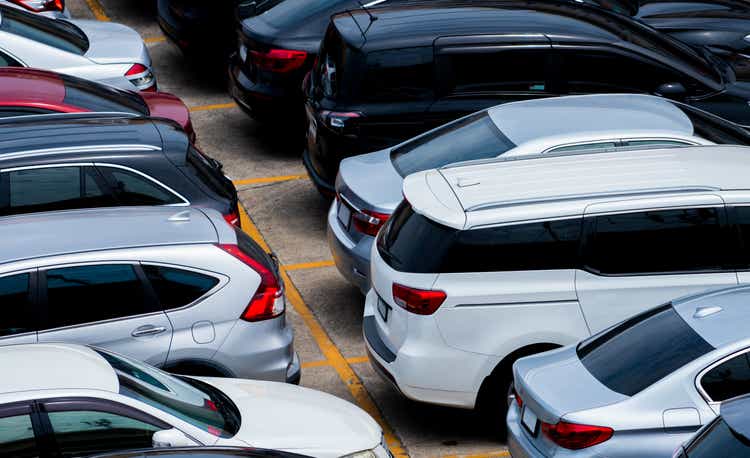 Car parked at the parking lot of the airport for rental. Aerial view of car parking lot of the airport. Used luxury car for sale and rental service. Automobile parking space. Car dealership concept.