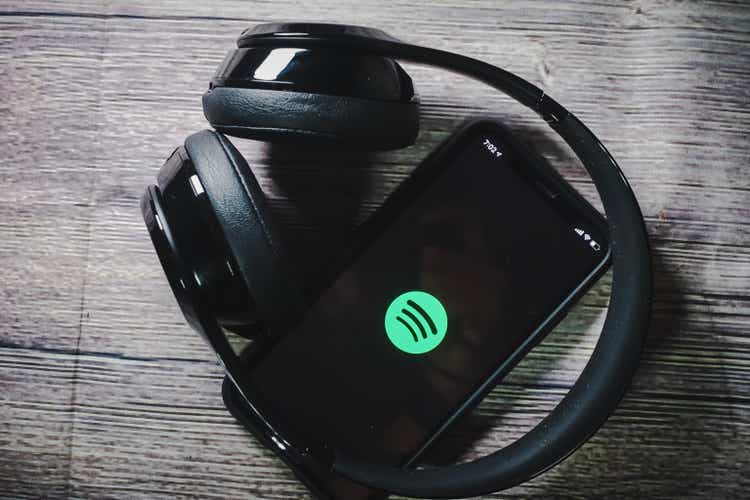 An iphone 11 screen showing spotify icon
