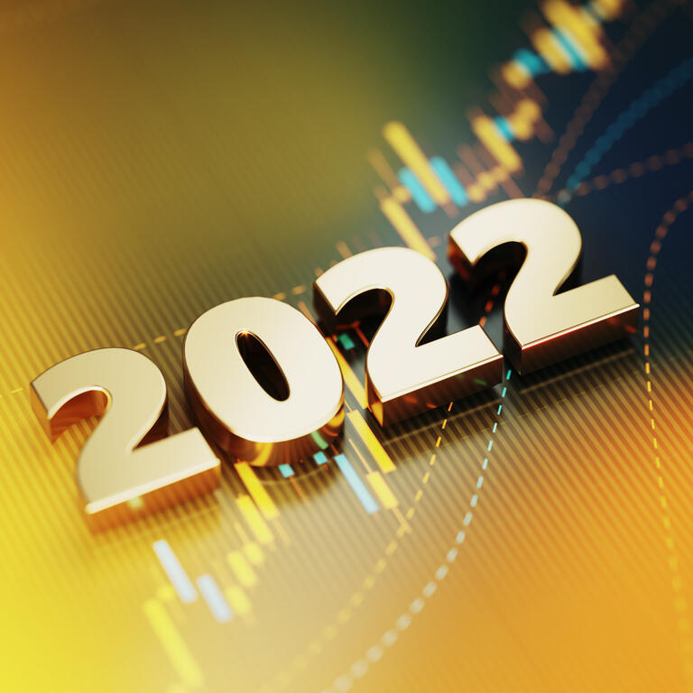 Investment And Finance Concept - 2022 Sitting On Yellow Financial Graph Background
