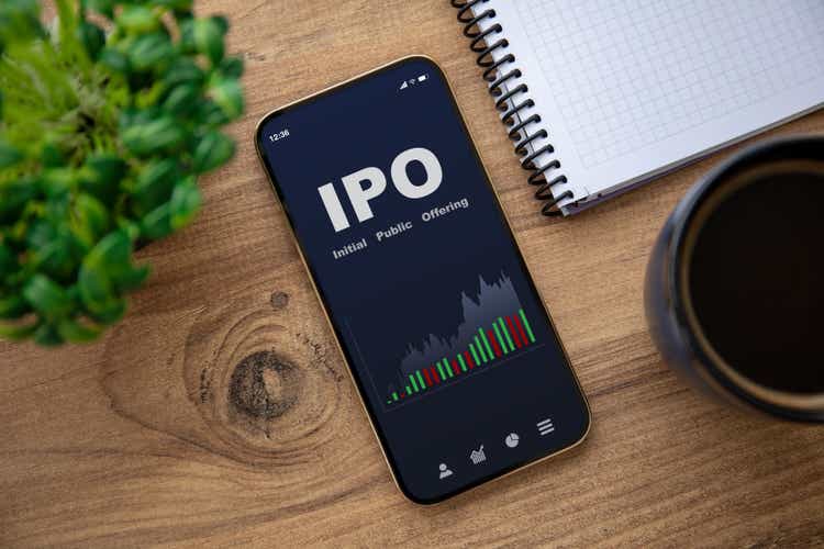 gold phone with IPO stock buying app on screen