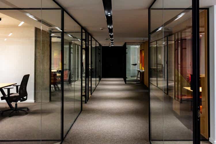Empty corridor in modern office building at night