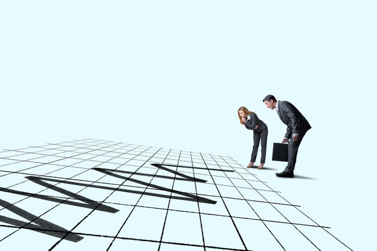 Man And Woman Looking Down At Market Volatility