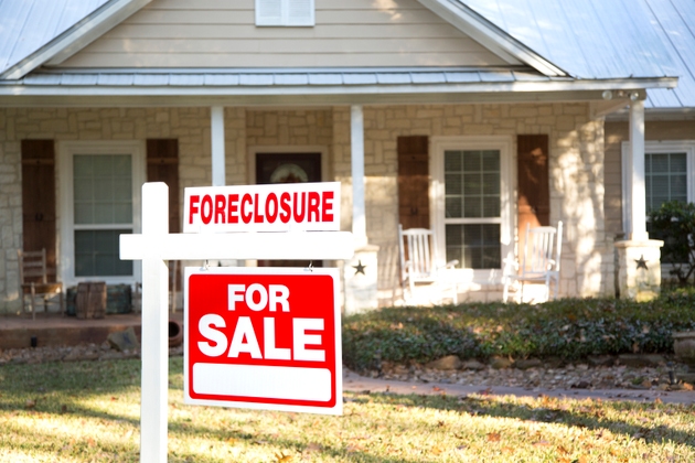 Home for sale with real estate sign. Front Yard.