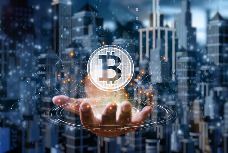 Businessman is holding a bitcoin as part of a business network, Cryptocurrency blockchain connection, Technology and financial investment background concept.