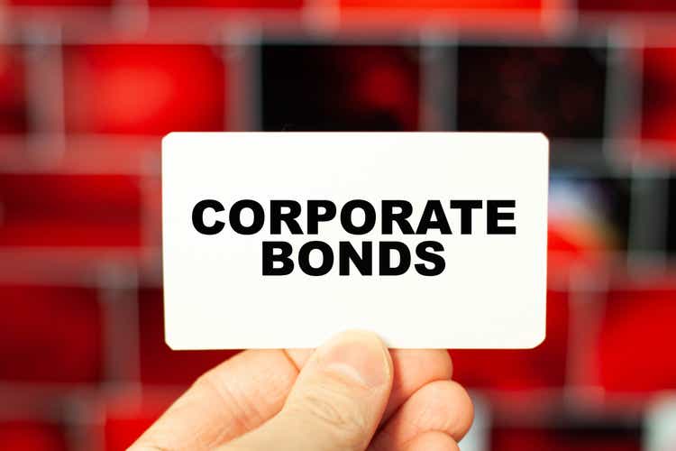 The concept of CORPORATE BONDS holds a businessman on a business card in his hand