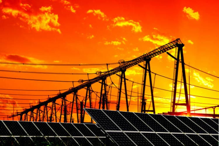 Solar photovoltaic panels and pylons in the evening