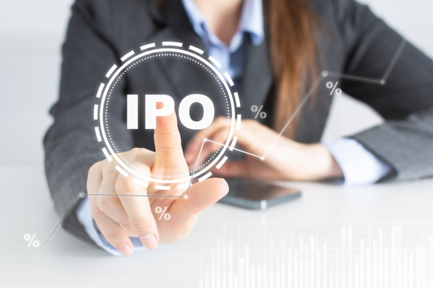 Businesswoman touch IPO icon on digital virtual trading screen. Stock market.
