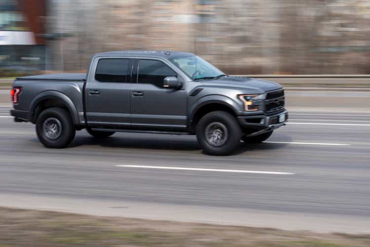 Gray Ford F-150 car moving on the street.