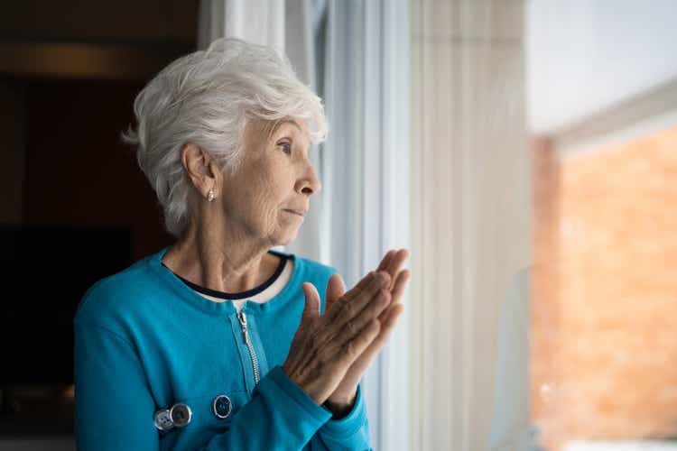 Senior woman contemplating at home
