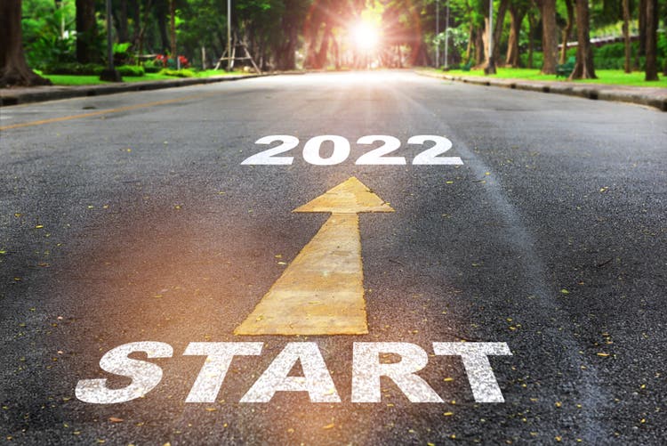 Start to 2022 written on the road on nature background with sunlight