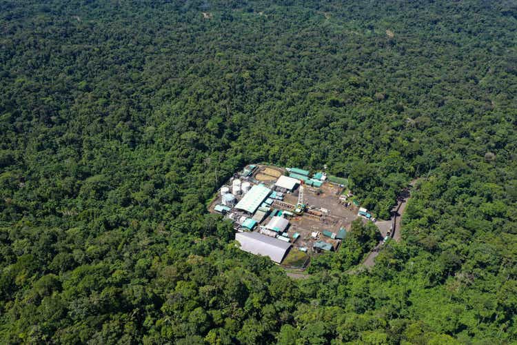 Top view, still video of an oil pumping platform in an oil field of the Amazon rainforest of South America