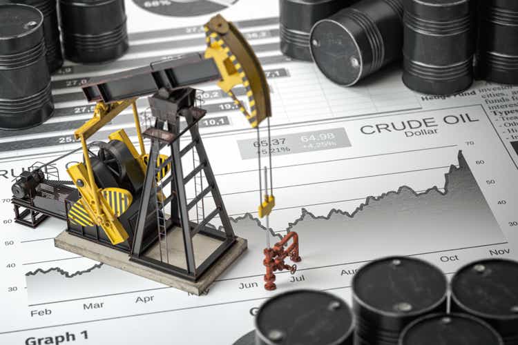 Oil pump jack and barrels on newpaper with growth of price of crude oil. Stock market of crude oil, investment and petroleum industry.
