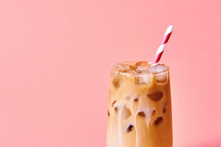 Close-up Iced Coffee with Milk in Tall Glasses on Pink Background. Concept Refreshing Summer Drink