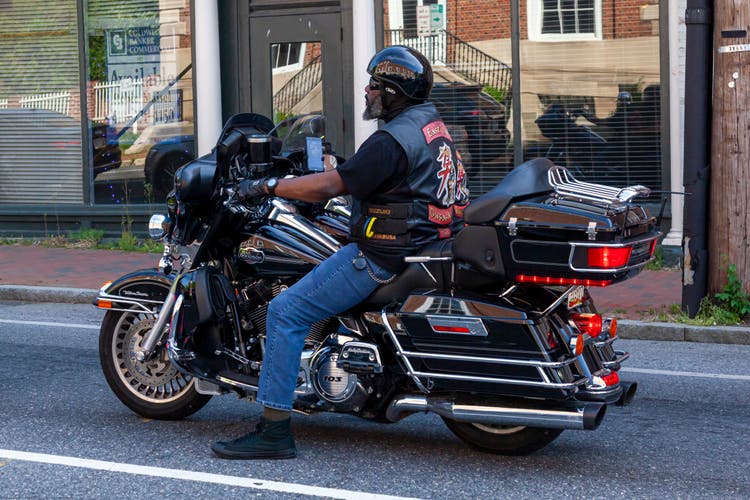 African American man riding Harley Davidson