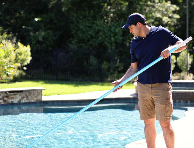 Repairman, cleaning service man at home swimming pool