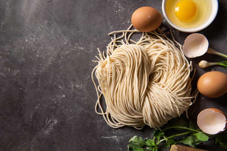 Making Handmade Noodles.raw egg noodles on board.