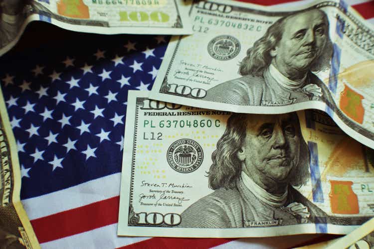 Hundred Dollar Bills On The American Flag Close Up With Lomo Effect High Quality