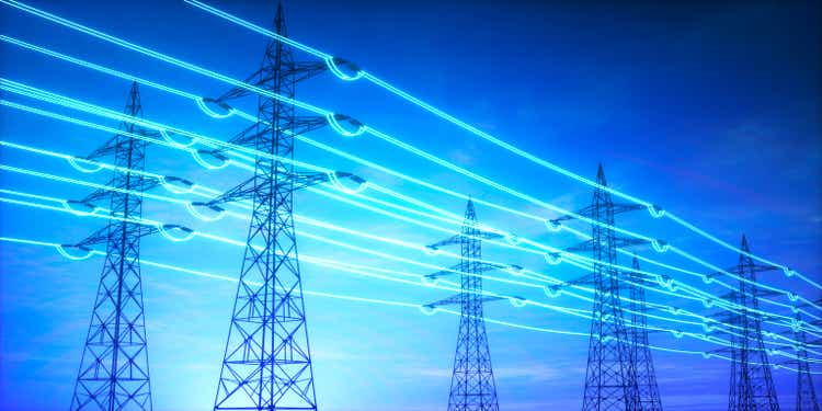 Electricity transmission towers with glowing wires
