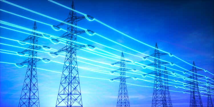 Electricity transmission towers with glowing wires