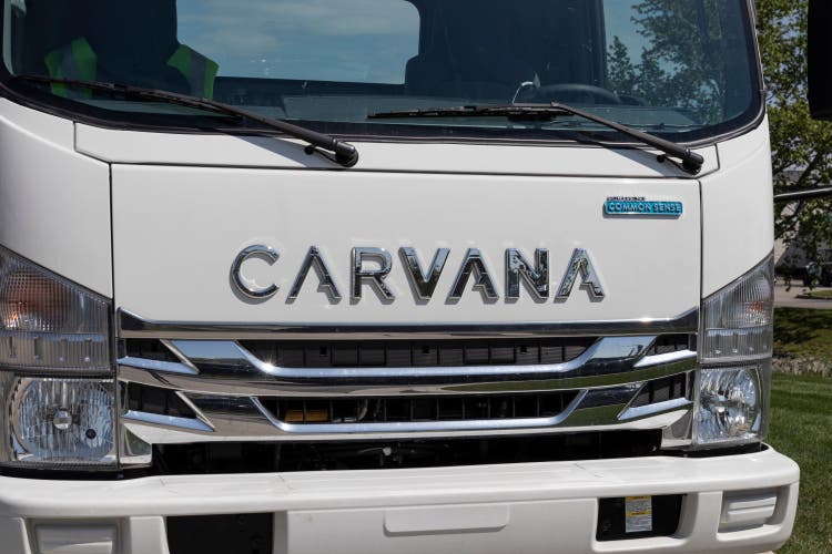 Carvana Vehicle Transport loader. Carvana is an online only preowned and used car dealership.