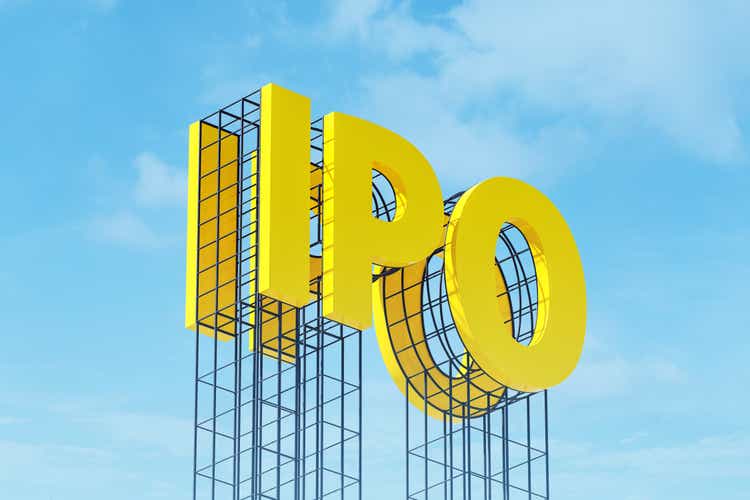 Large yellow sign on metal frame with the word IPO