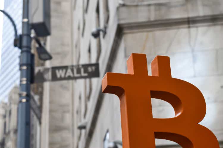 Bitcoin overlooks Wall Street in downtown Manhattan.