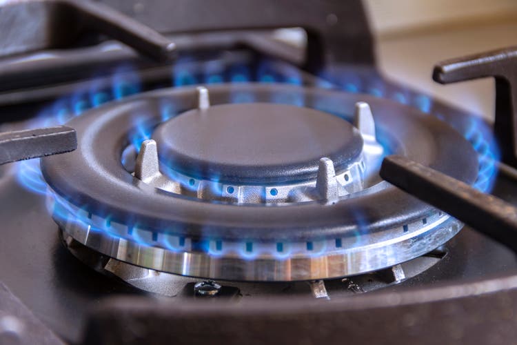 A burning gas burner in the kitchen.