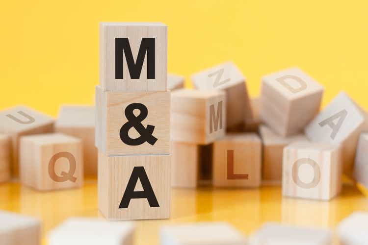 word M and A made with wood building blocks, concept