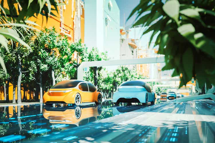 Futuristic green city with generic autonomous electric cars