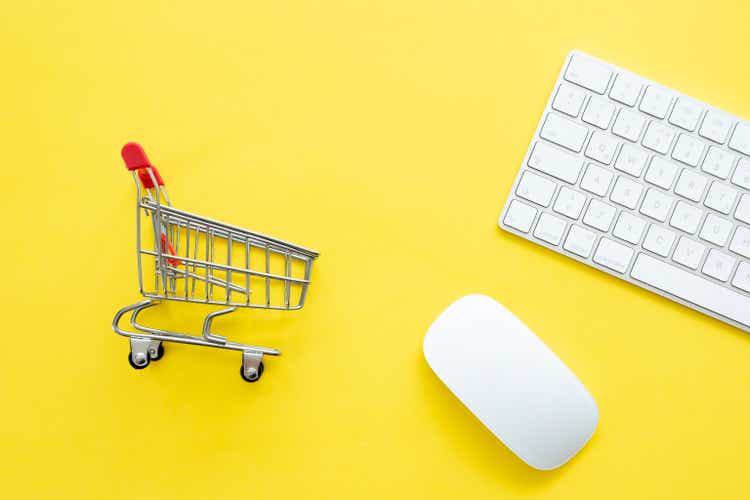 shopping cart and mouse on yellow background