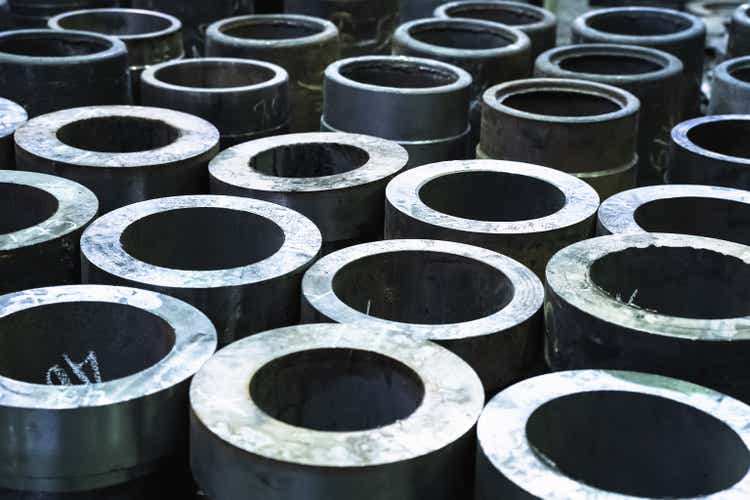 Finished metal cylindrical tubular pipe products in metal processing plant
