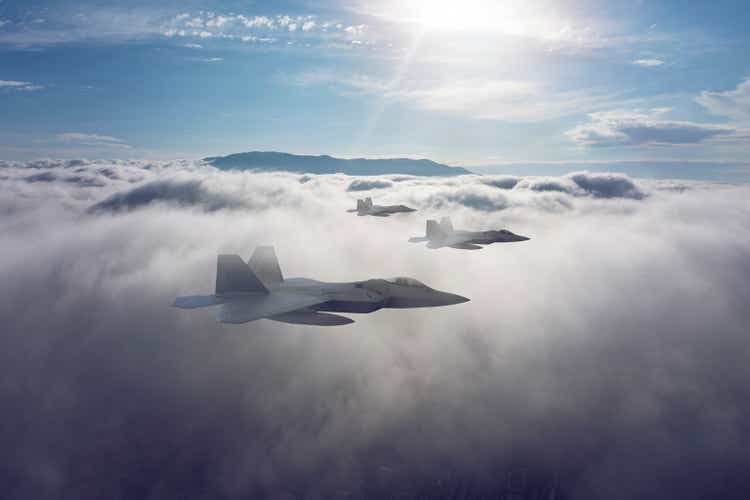 Jet fighters flying over the clouds.