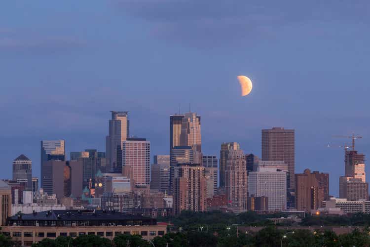 The 2021 Lunar Eclipse Begins over the Minneapolis Skyline during a May Morning Twilight