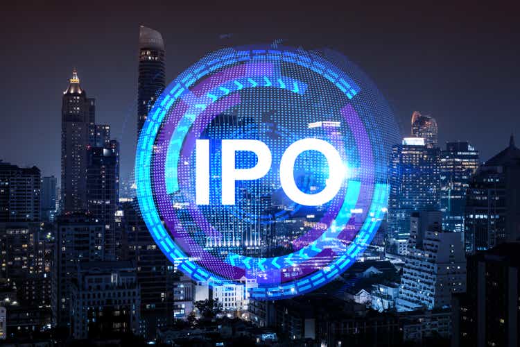 Initial public offering hologram, night panoramic view of Bangkok. A financial center for multinational corporations in Asia. The concept of enhancing growth through the IPO process. Double exposure.